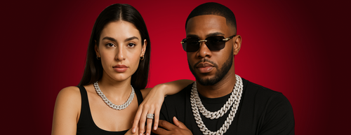 Two people wearing jewelry against a red background