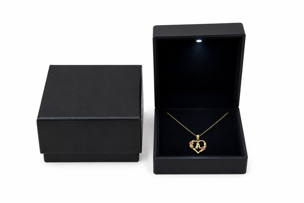 10K gold heart and flower initial pendant with 18 inch chain presented in black gift box