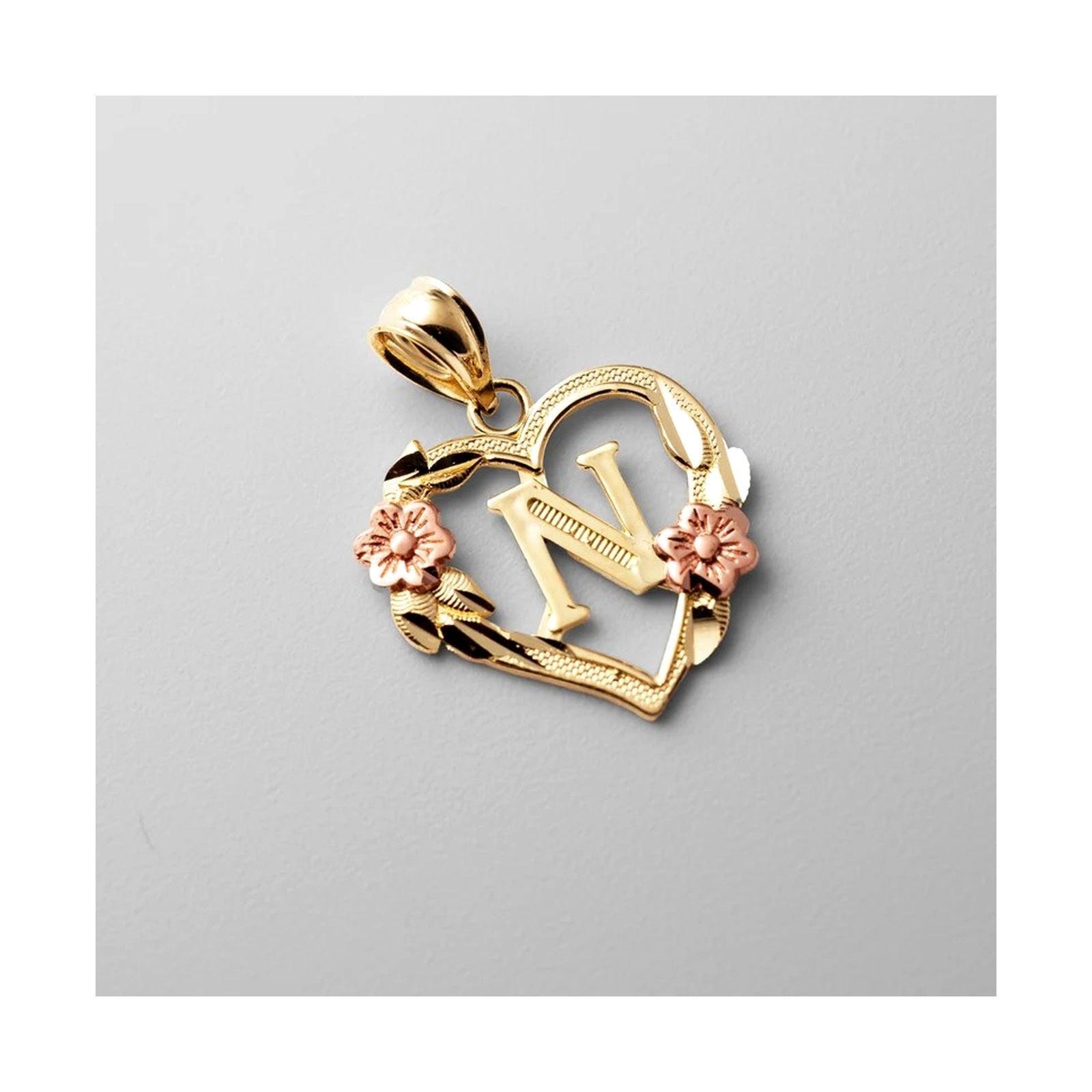 10K gold heart and flower initial pendant N on clean white background