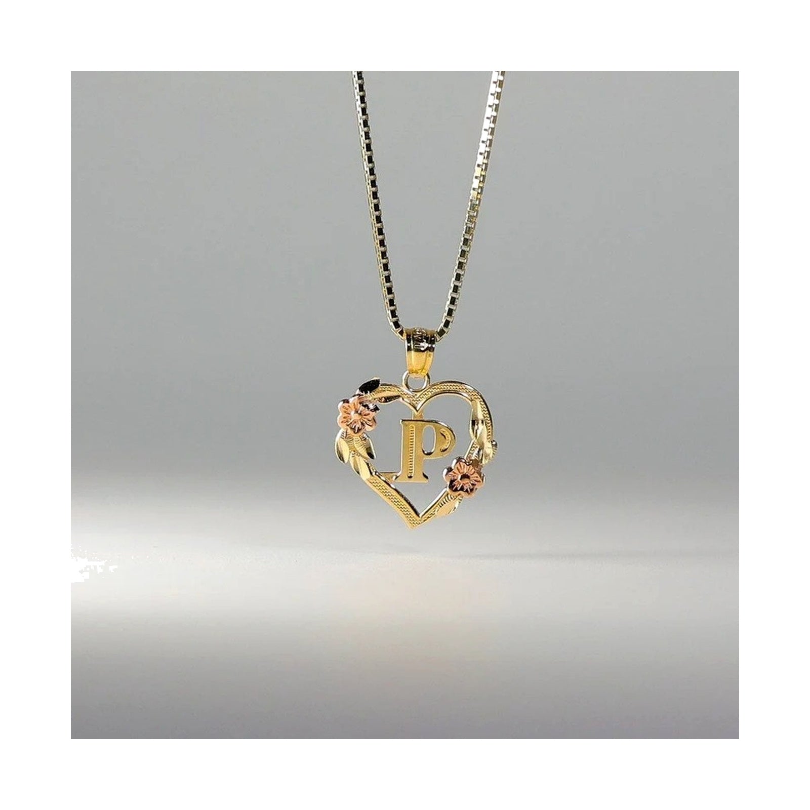 10K gold heart and flower initial pendant P on clean white background