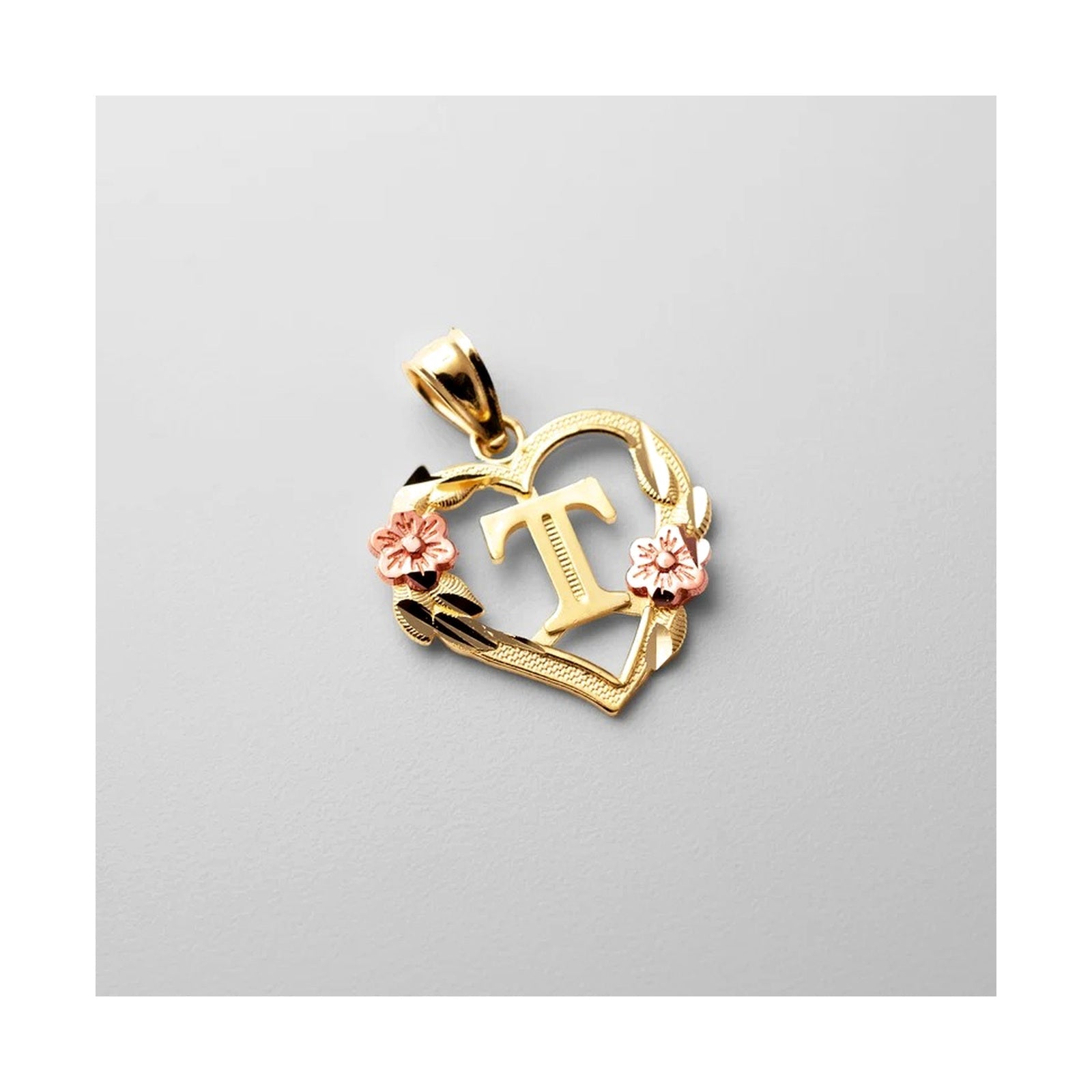 10K gold heart and flower initial pendant T on clean white background