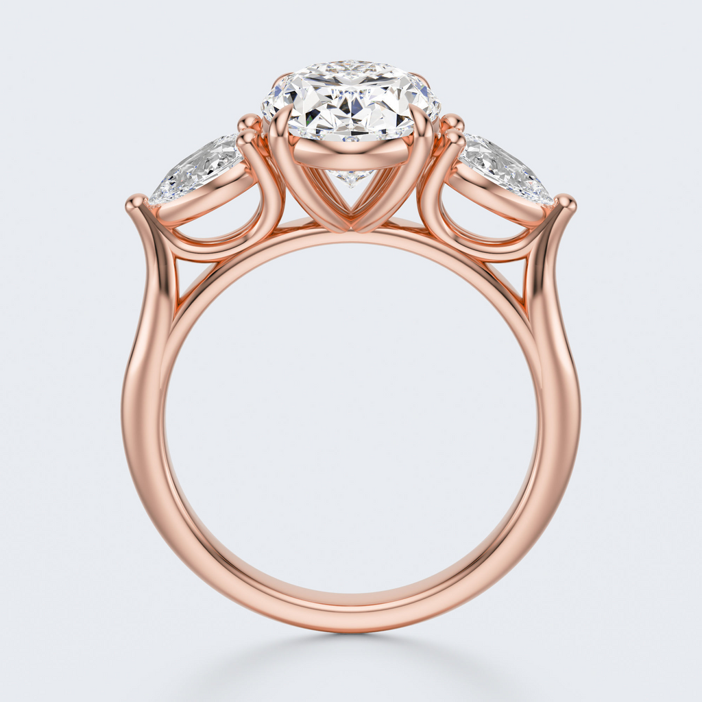 Rose gold three-stone oval and pear lab-grown diamond engagement ring side profile