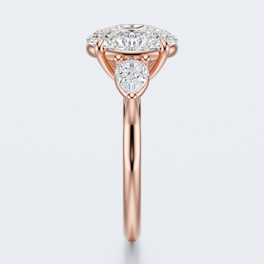 Rose gold three-stone oval and pear lab-grown diamond engagement ring end profile