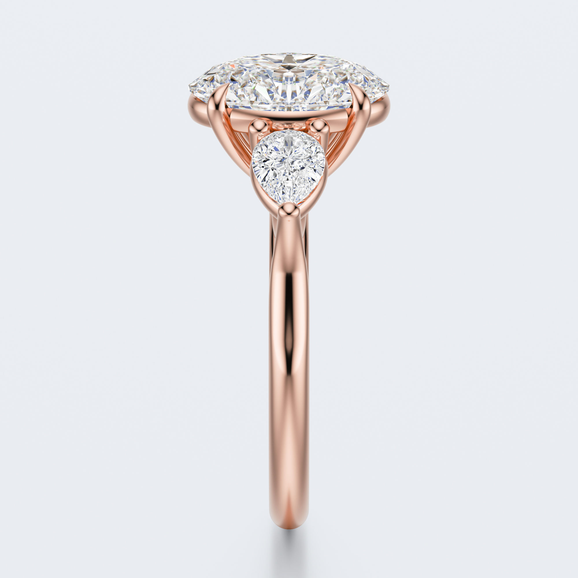 Rose gold three-stone oval and pear lab-grown diamond engagement ring end profile