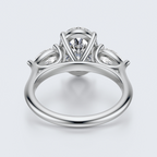 White gold three-stone oval and pear lab-grown diamond engagement ring underside view