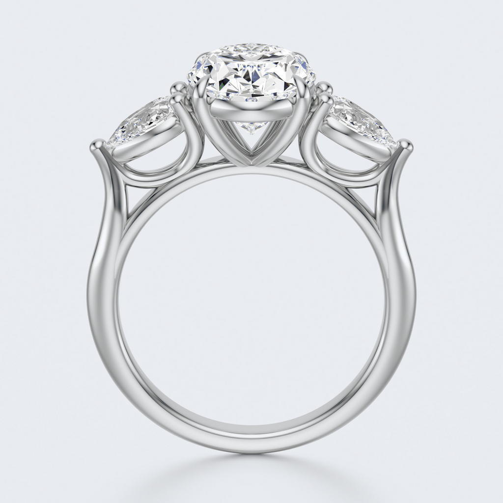 White gold three-stone oval and pear lab-grown diamond engagement ring front and profile views