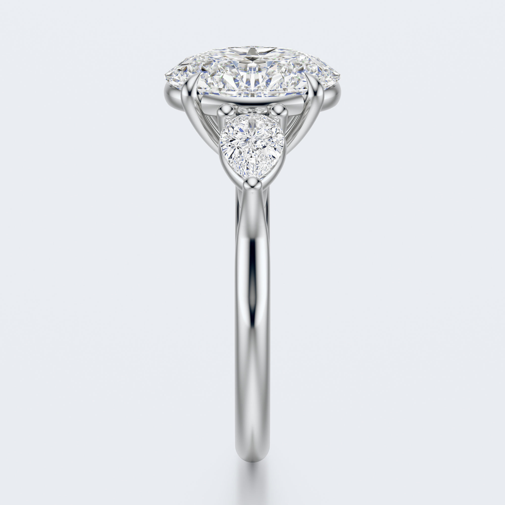 White gold three-stone oval and pear lab-grown diamond engagement ring end profile