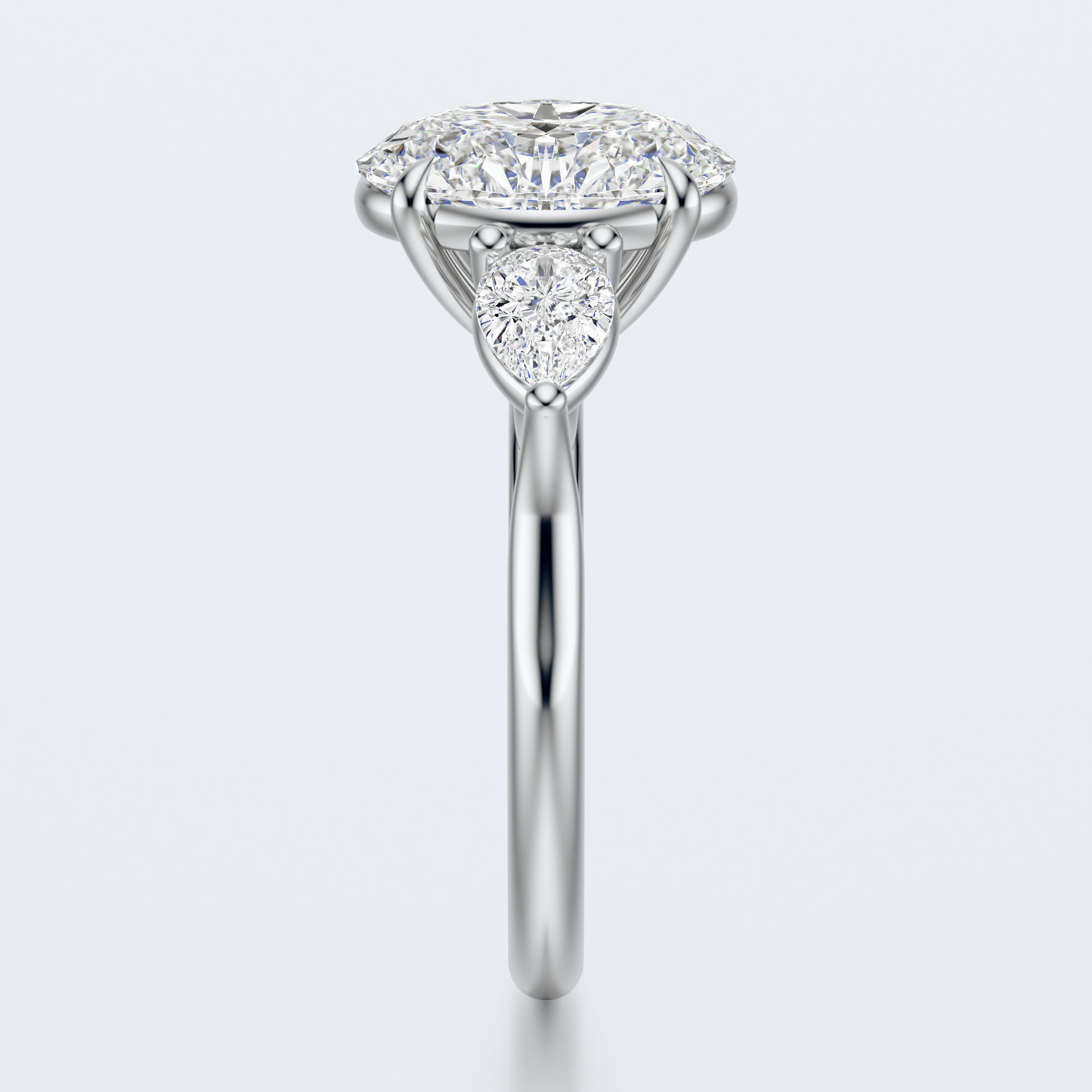 White gold three-stone oval and pear lab-grown diamond engagement ring end profile