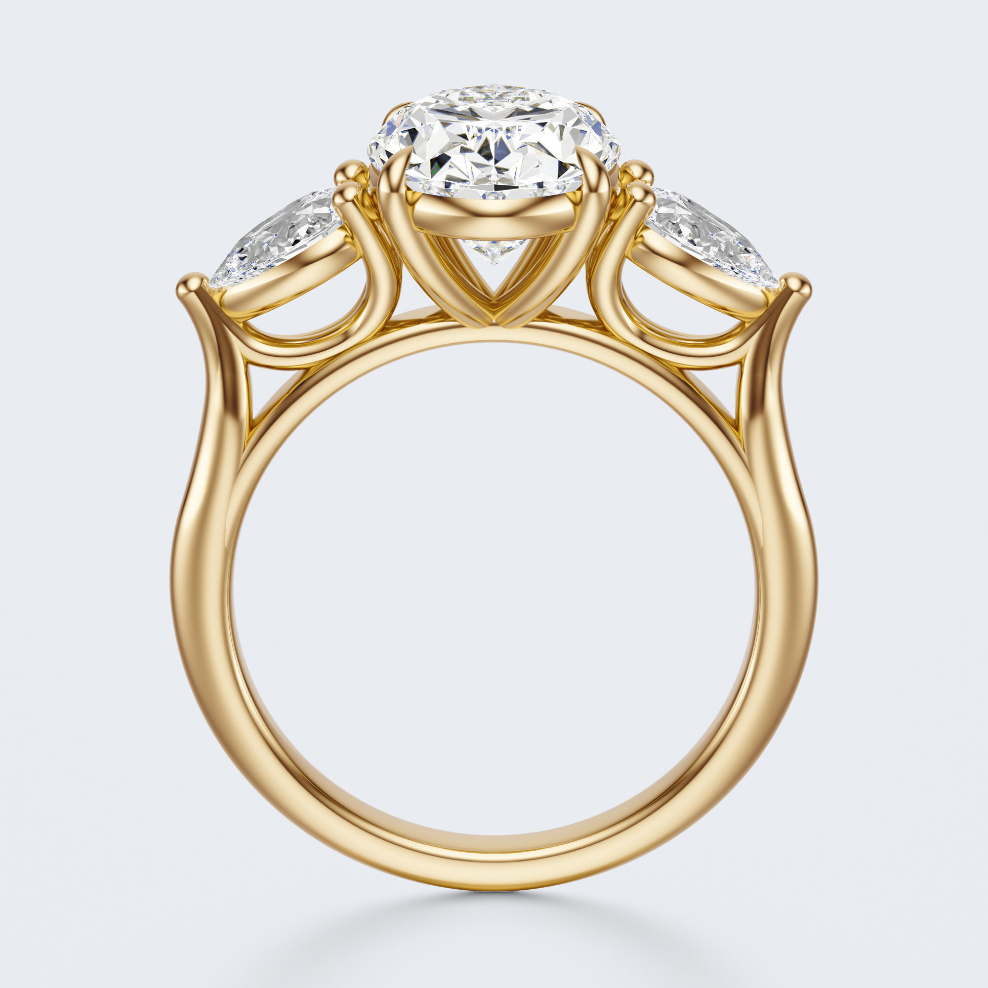 Yellow gold three-stone oval and pear lab-grown diamond engagement ring side profile