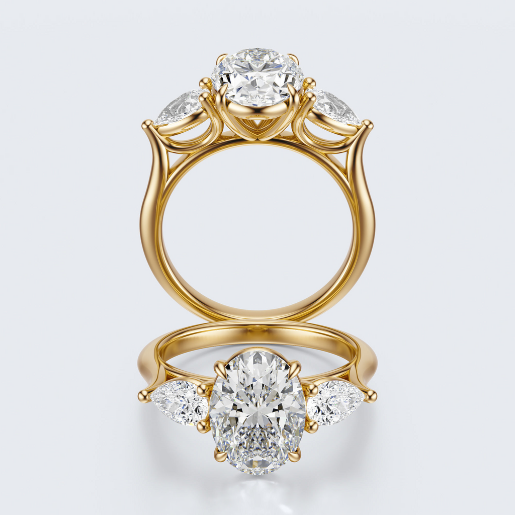 Yellow gold three-stone oval and pear lab-grown diamond engagement ring full front and profile views