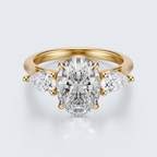 Yellow gold three-stone oval and pear lab-grown diamond engagement ring top view