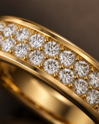 Macro view of two-row lab grown diamond eternity band in 14K yellow gold