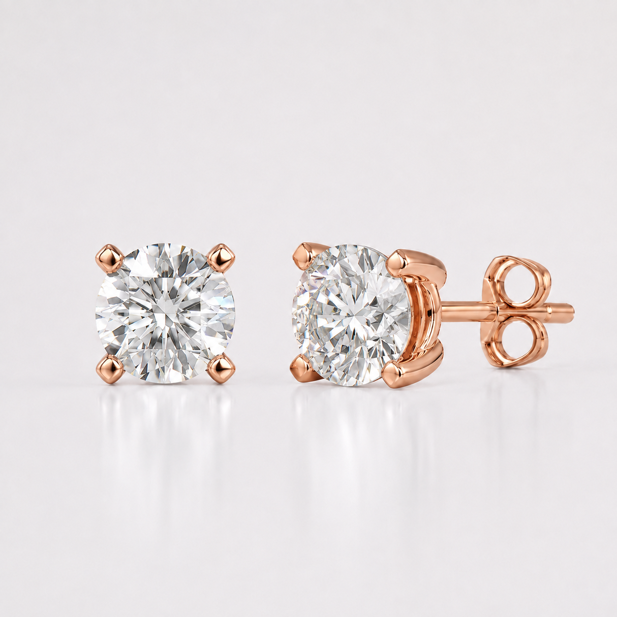 Rose gold round lab grown diamond stud earrings with four prong solitaire setting