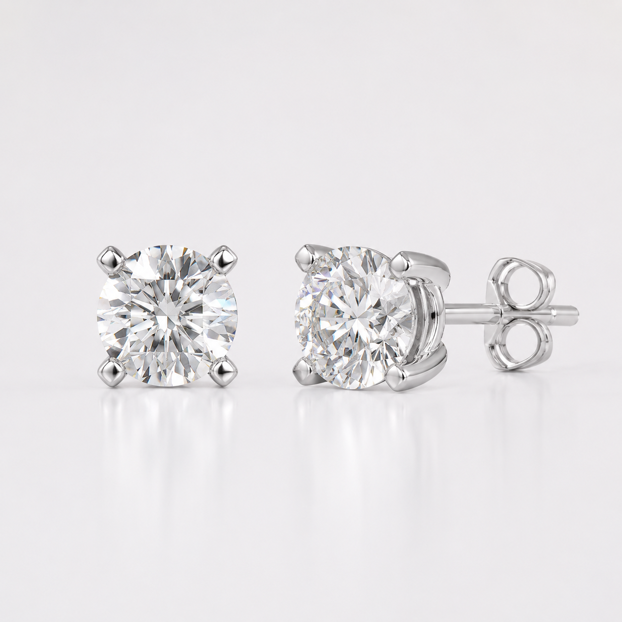 White gold round lab grown diamond stud earrings with four prong solitaire setting