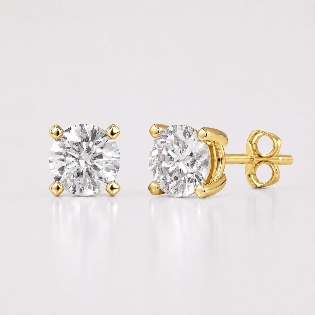 Yellow gold round lab grown diamond stud earrings with four prong solitaire setting